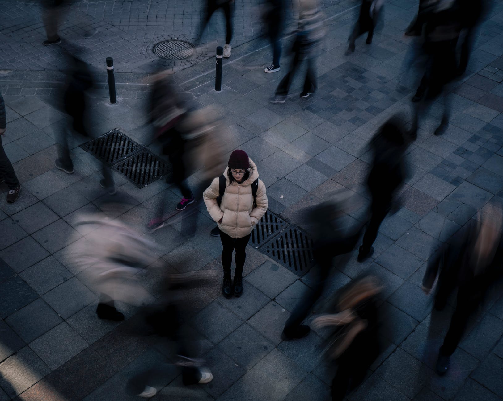 woman standing alone in crowd