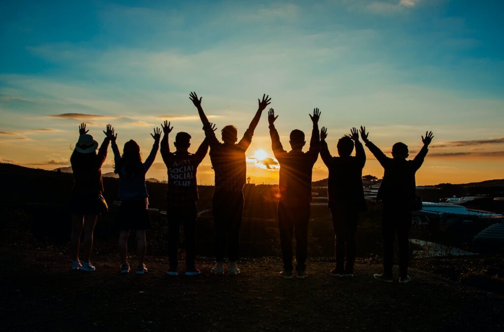 people silhouette during sunset